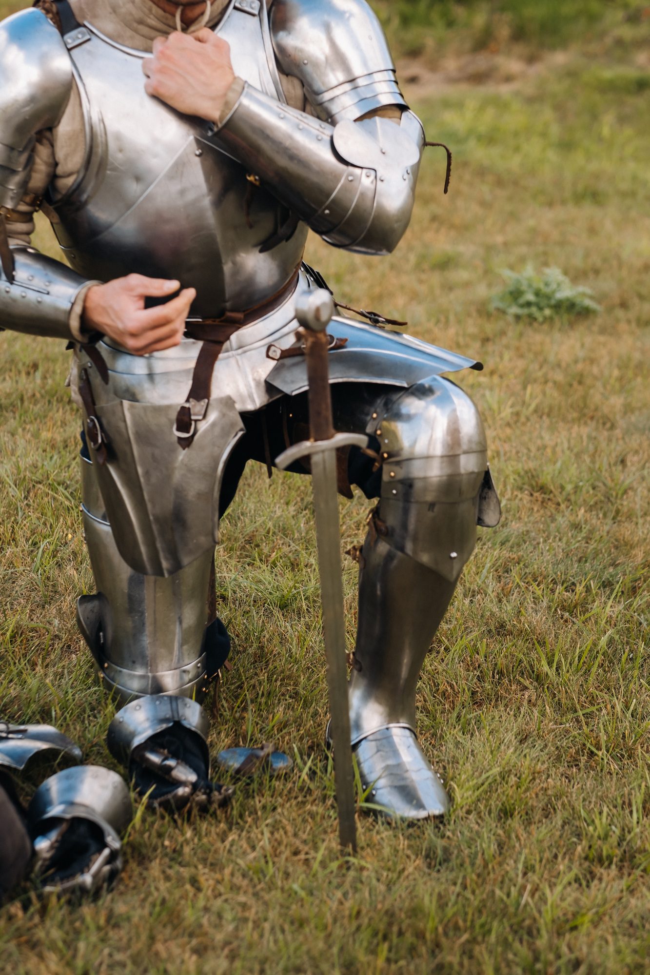 Close-up of a medieval knight in armor preparing for battle